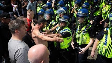 Scene of police being confronted by rioters