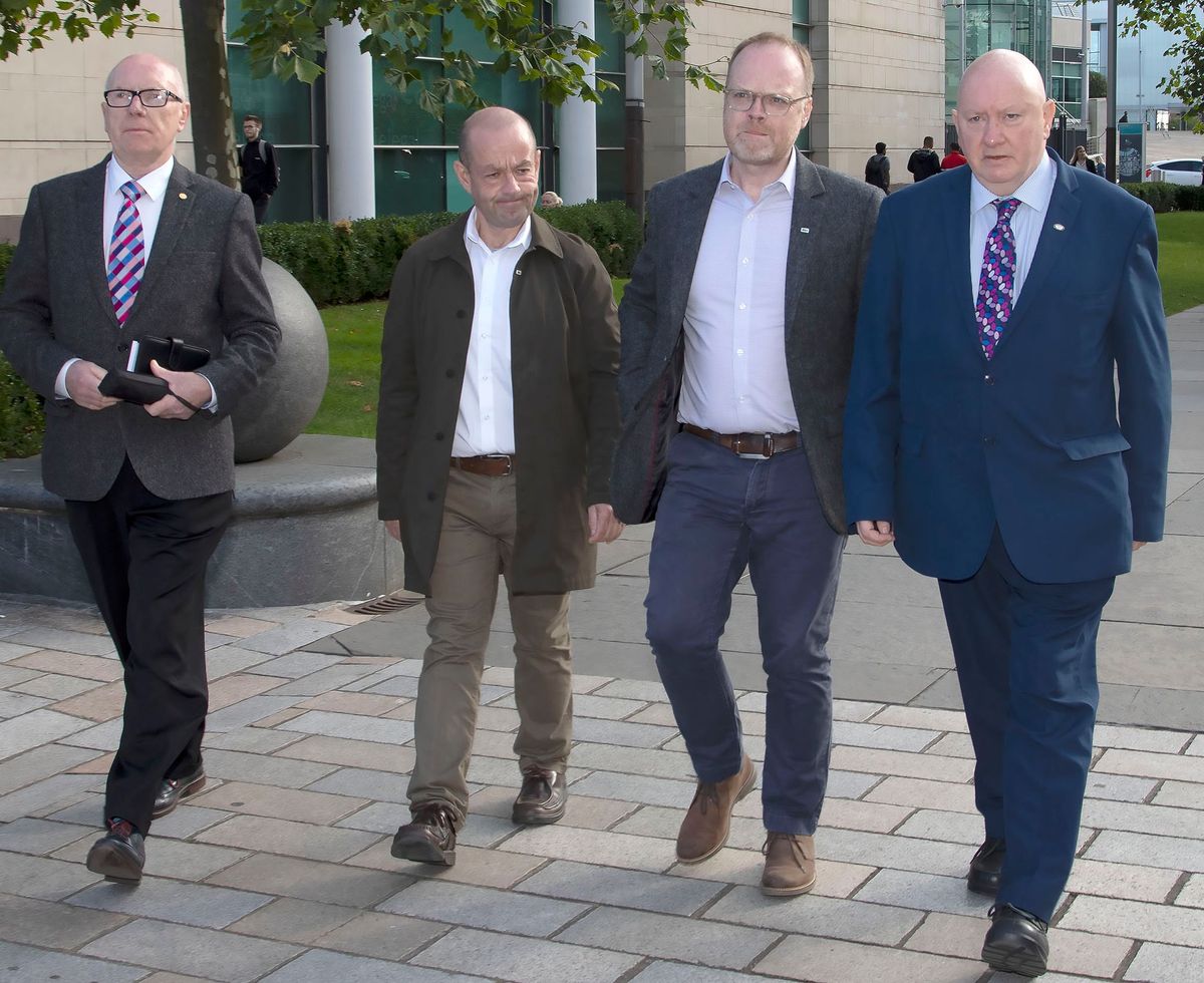 Gerry Carson, NUJ Irish Executive Cathaoirleach, NUJ member Barry McCaffrey, Trevor Birney, and NUJ assistant general secretary, Séamus Dooley at the Courts of Justice in Belfast on Friday 7 September